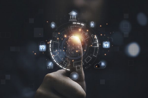 Man using thumb to scan finger print or for digital processing  biometric identification  to access  security system includes internet banking, cloud system and mobile phone , Cyber security concept.